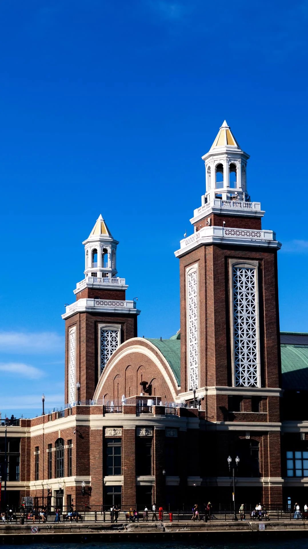 Navy Pier's brick towers against a vivid blue sky