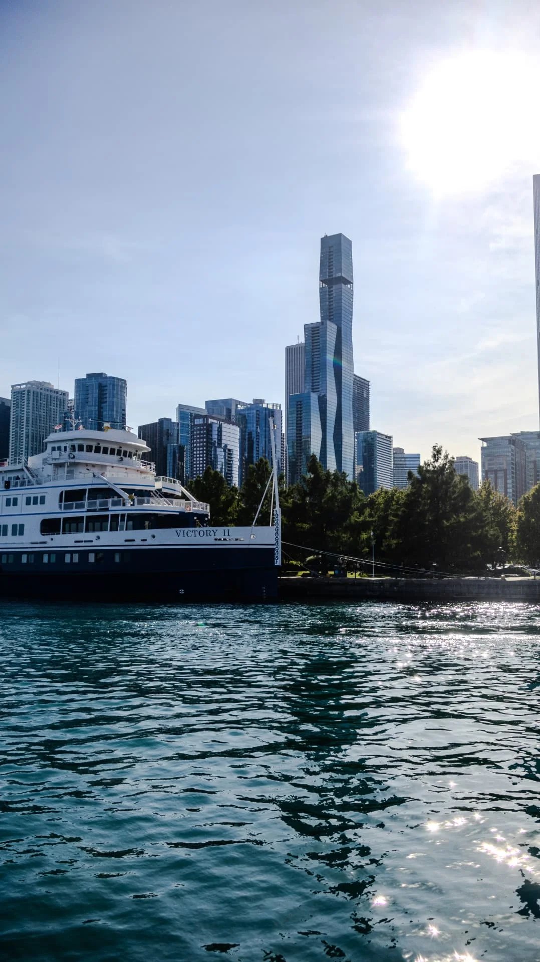 Cruise ship Victory II docked below the Chicago skyline
